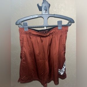 Maroon graffiti swoosh nike shorts